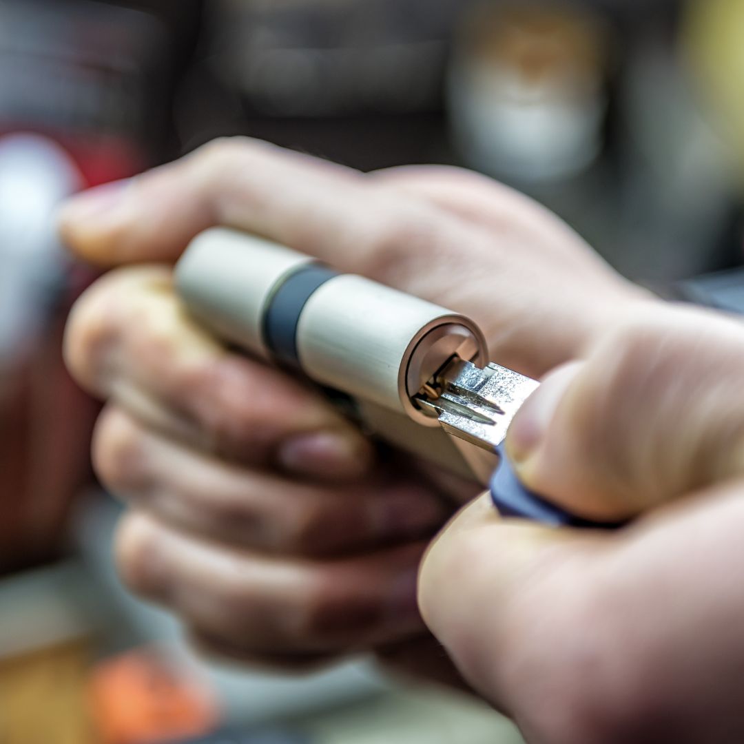 A Close Up Of a Technician Rekeying A Lock Cylinder.