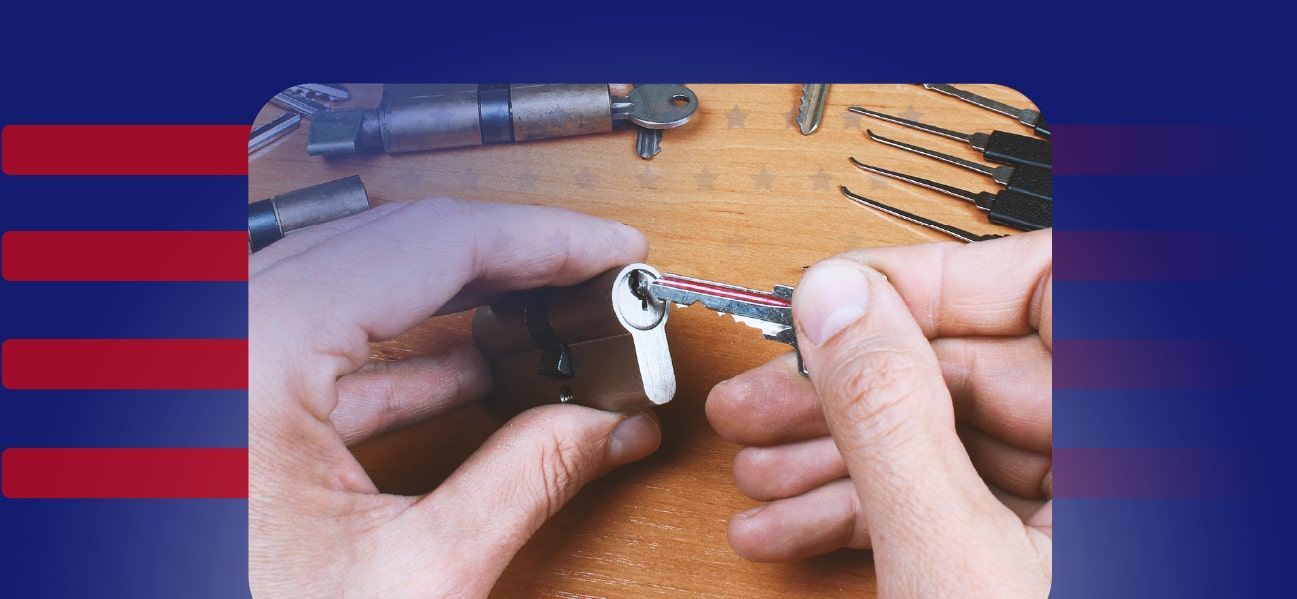 A Locksmith Holding A Lock Cylinder And A Key.