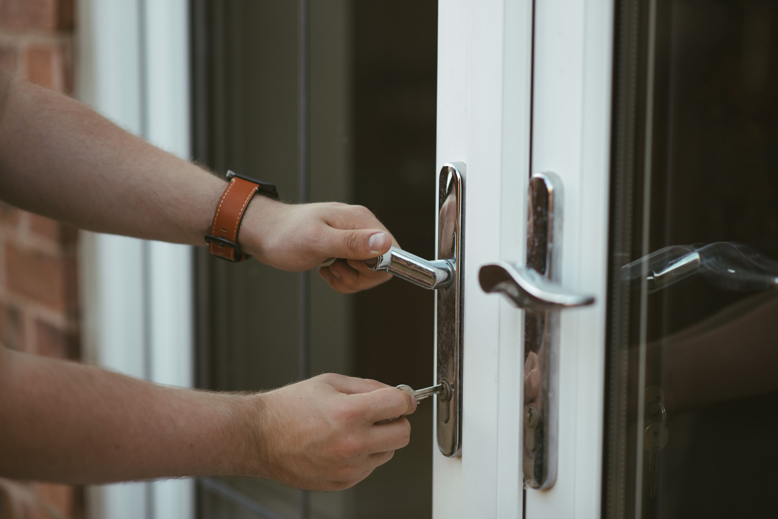 a man unlocking door with a master key